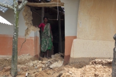 An adivasi woman was stading on from her damaged house002